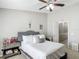 Bedroom with ceiling fan, neutral walls, and comfortable bed at 509 Artisan St # 43, Orlando, FL 32824