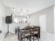 Eat-in kitchen features modern pendant lights and breakfast bar at 509 Artisan St # 43, Orlando, FL 32824