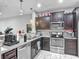 Stylish kitchen featuring granite countertops, stainless steel appliances, and ample cabinet space at 509 Artisan St # 43, Orlando, FL 32824