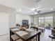 Bright living area with tiled floors, a dining table, and comfortable seating with access to natural light at 509 Artisan St # 43, Orlando, FL 32824