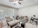 Relaxing living room with ceiling fan, tile floors, comfortable seating and natural light at 509 Artisan St # 43, Orlando, FL 32824