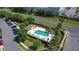 Overhead aerial view of a serene community pool with ample seating, perfect for relaxation at 509 Artisan St # 43, Orlando, FL 32824