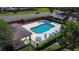 A pristine community pool featuring comfortable lounge chairs, and a covered picnic area at 509 Artisan St # 43, Orlando, FL 32824