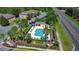 A luxurious community pool surrounded by lush landscaping and ample seating for residents at 509 Artisan St # 43, Orlando, FL 32824
