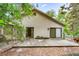 Backyard featuring a concrete patio area with leafy tree canopy at 600 Fallsmead Cir, Longwood, FL 32750