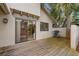 Backyard patio with grill, exterior home view, and lush landscaping at 600 Fallsmead Cir, Longwood, FL 32750