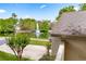 View of the home's landscaped backyard, showcasing the serene lake with a fountain at 600 Fallsmead Cir, Longwood, FL 32750