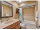 Well-lit bathroom with a vanity, mirror, and a bathtub, designed for relaxation and functionality at 600 Fallsmead Cir, Longwood, FL 32750