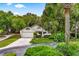 Charming single-Gathering home featuring a well-maintained lawn and mature landscaping at 600 Fallsmead Cir, Longwood, FL 32750