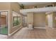 Open-concept living room with tile flooring, natural light, and access to the outdoors at 600 Fallsmead Cir, Longwood, FL 32750