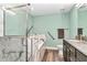 Bright bathroom featuring soaking tub, marble accents, glass shower, and double sink vanity at 6144 Avenue G, Mc Intosh, FL 32664