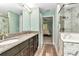 Ensuite bathroom features double sinks, marble accents, and a glass shower at 6144 Avenue G, Mc Intosh, FL 32664