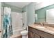 Well-lit bathroom with forest-themed shower curtain and sink at 6144 Avenue G, Mc Intosh, FL 32664