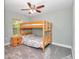 Comfortable bedroom with a bunkbed, ceiling fan, and a window at 6144 Avenue G, Mc Intosh, FL 32664