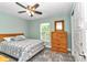Bedroom with ceiling fan, a dresser, and a window at 6144 Avenue G, Mc Intosh, FL 32664