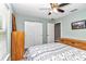 Bedroom with ceiling fan and wooden dresser at 6144 Avenue G, Mc Intosh, FL 32664