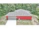 Lovely single Gathering home featuring an attached two car garage and durable gray shingle roof in a wooded neighborhood at 6144 Avenue G, Mc Intosh, FL 32664