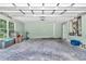 Spacious garage with utility connections, large windows, and ample room for vehicles and storage at 6144 Avenue G, Mc Intosh, FL 32664