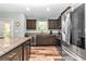 Modern kitchen featuring stainless steel appliances and granite countertops at 6144 Avenue G, Mc Intosh, FL 32664