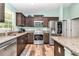 Updated kitchen featuring stainless steel appliances and granite countertops at 6144 Avenue G, Mc Intosh, FL 32664