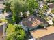 Birds-eye view of home showing brown roof, backyard patio, mature landscaping, and proximity to other residential properties at 7027 Villa Estelle Drive, Orlando, FL 32819
