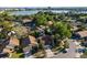 Aerial view of a residential neighborhood near the lake and cityscape in the distance at 7027 Villa Estelle Drive, Orlando, FL 32819