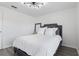 Bright bedroom with stylish bed, large window, and modern ceiling light at 7027 Villa Estelle Drive, Orlando, FL 32819