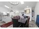 Open dining room with lots of natural light, hardwood floors, and an open floor plan at 7027 Villa Estelle Drive, Orlando, FL 32819