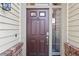 Exterior showcases a front door with sidelight, knocker, peephole, and brick detail at 7027 Villa Estelle Drive, Orlando, FL 32819