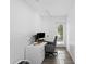 Modern home office featuring a computer setup, natural light, and hardwood floors at 7027 Villa Estelle Drive, Orlando, FL 32819