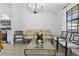 Bright living room with large window, natural light, and stylish furniture at 7027 Villa Estelle Drive, Orlando, FL 32819