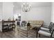 Open-concept living room with modern lighting, and comfortable seating at 7027 Villa Estelle Drive, Orlando, FL 32819