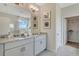 Bathroom featuring double sinks, granite countertops, and modern fixtures at 7225 Nottingham Reel Ct, St Cloud, FL 34773