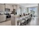 Beautiful kitchen with stainless appliances, granite countertops, and breakfast bar seating at 7225 Nottingham Reel Ct, St Cloud, FL 34773