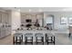Bright kitchen features granite countertops, stainless appliances, and breakfast bar with stool seating at 7225 Nottingham Reel Ct, St Cloud, FL 34773
