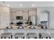 Spacious kitchen with granite countertops, stainless steel appliances, and barstool seating at 7225 Nottingham Reel Ct, St Cloud, FL 34773