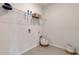Laundry room with washer/dryer hookups and shelving at 7225 Nottingham Reel Ct, St Cloud, FL 34773