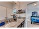Stylish bathroom featuring a double vanity with granite countertops and modern fixtures at 7237 Nottingham Reel Ct, St Cloud, FL 34773