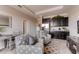 Inviting living room area featuring a kitchenette, comfortable seating, and modern decor at 7237 Nottingham Reel Ct, St Cloud, FL 34773