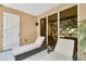 Balcony with lounge chairs and ample light filtering through a sliding glass door at 7645 Recife Dr, Kissimmee, FL 34747