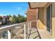 Condo balcony offers an open-air space with glass railings and views of the community and parking area at 7645 Recife Dr, Kissimmee, FL 34747