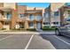 Inviting townhouse featuring a private balcony and well-maintained landscaping at 7645 Recife Dr, Kissimmee, FL 34747