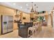 Bright kitchen featuring stainless steel appliances, a spacious island, and sleek cabinets at 7645 Recife Dr, Kissimmee, FL 34747