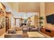 Open-concept living area featuring comfortable seating and easy access to the modern kitchen at 7645 Recife Dr, Kissimmee, FL 34747