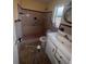 Bathroom featuring a walk-in shower, updated fixtures, and a functional layout at 808 Woodling Pl, Altamonte Springs, FL 32701