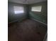 Simple bedroom offering a functional layout with neutral carpeting and natural lighting at 808 Woodling Pl, Altamonte Springs, FL 32701