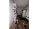 Utility room featuring a water heater, shelving, and ample storage space for household needs at 808 Woodling Pl, Altamonte Springs, FL 32701