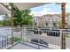 Balcony view of complex with multiple townhomes with lush trees and well-maintained landscaping at 810 Greybull Run, Lake Mary, FL 32746
