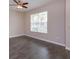 Neutral bedroom featuring a ceiling fan and a window bringing in lots of natural light at 810 Greybull Run, Lake Mary, FL 32746
