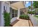 Charming entryway featuring a teal door and brick paver patio at 810 Greybull Run, Lake Mary, FL 32746